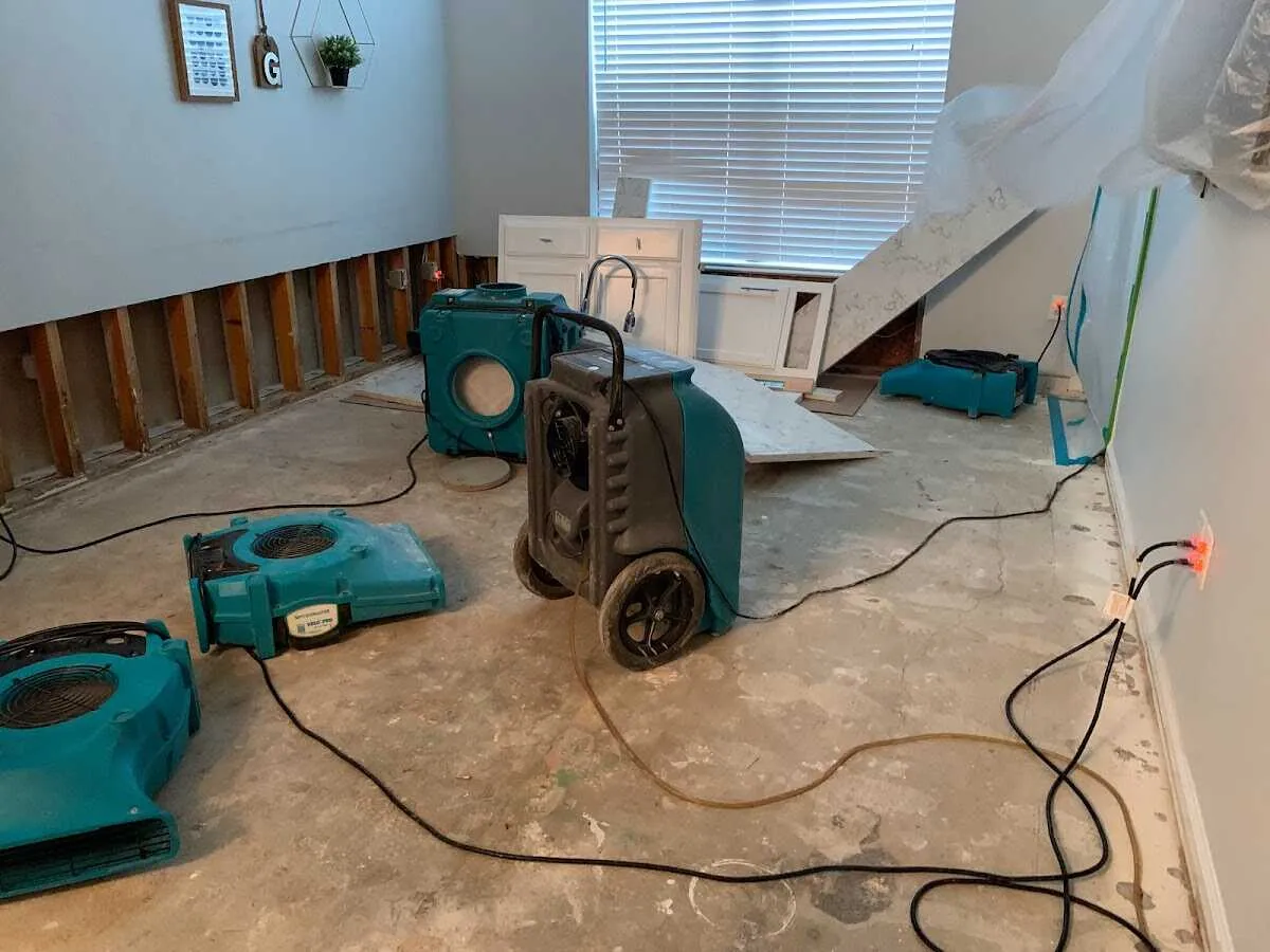 Dehumidifier in flood-cut room for Water Damage Restoration in Urbana